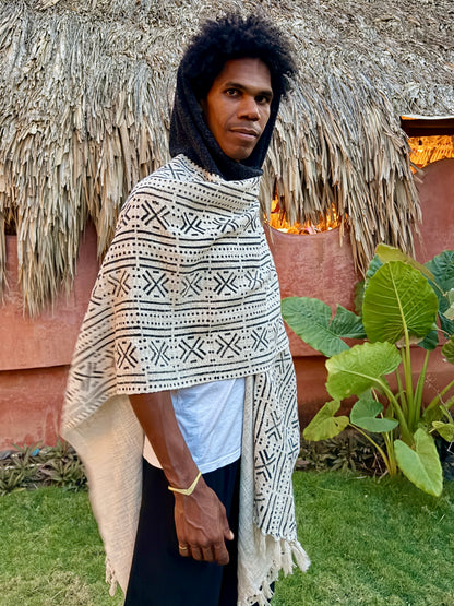 a man standing in glorka handblock printed poncho with dark gray hood