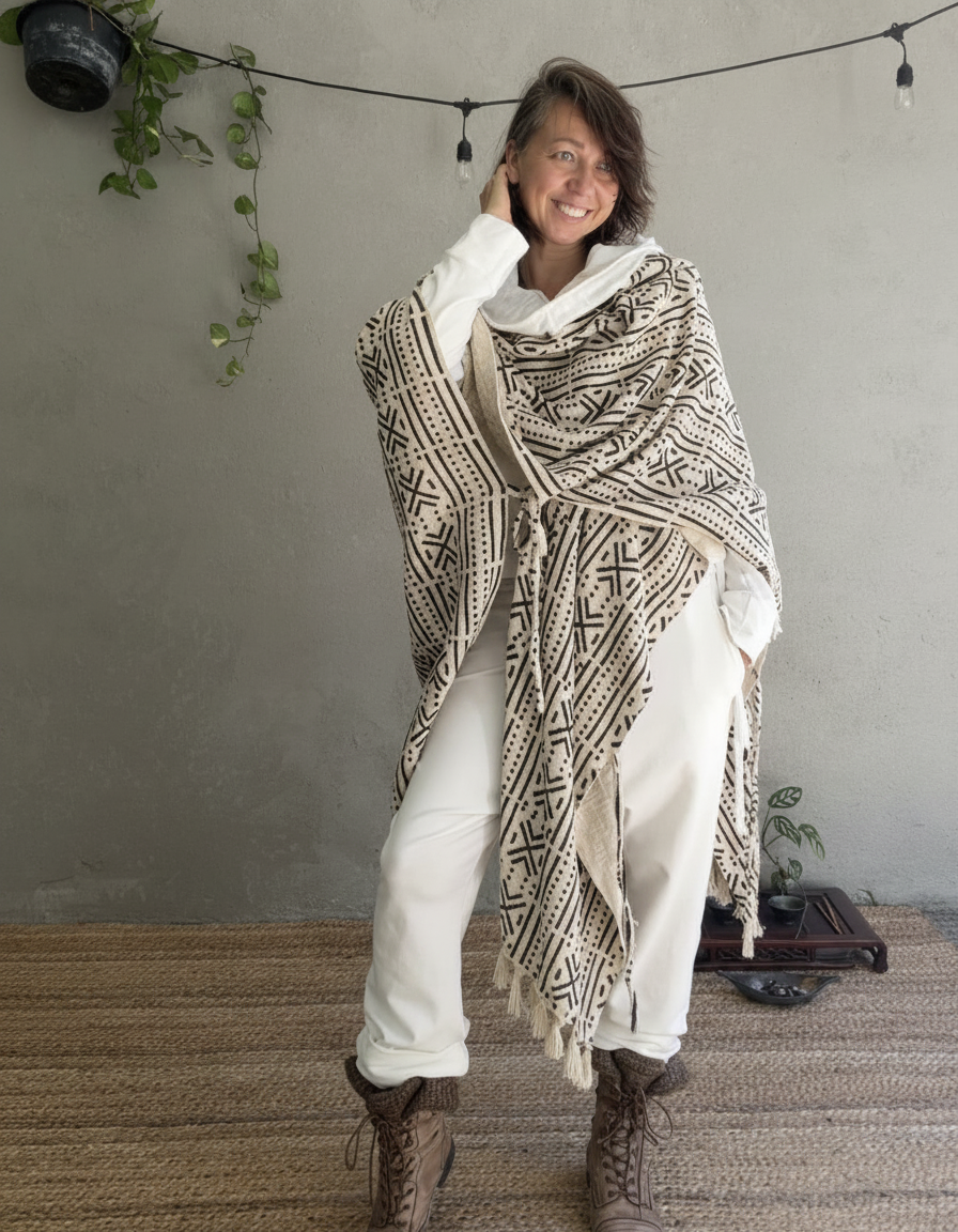 a woman standing in glorka handblock printed poncho with white hood