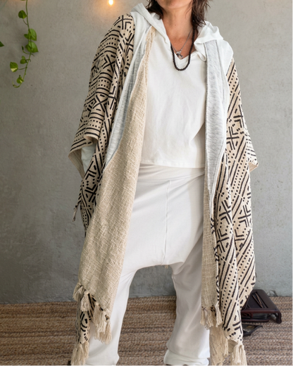 a woman standing in glorka handblock printed poncho with white hood