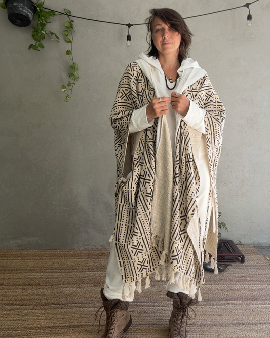 a woman standing in glorka handblock printed poncho with white hood
